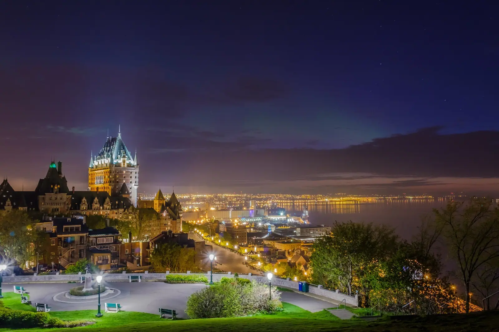 Château Frontenac at night from the Pierre-Dugua-De-Mons Terrace, with the Northern Lights