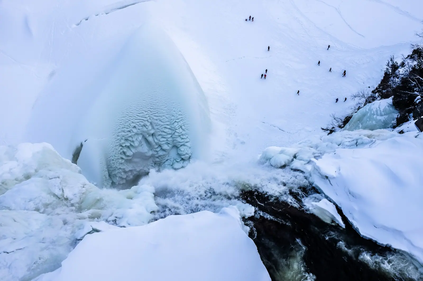 Ice sugarloaf at the base of Montmorency Falls in winter