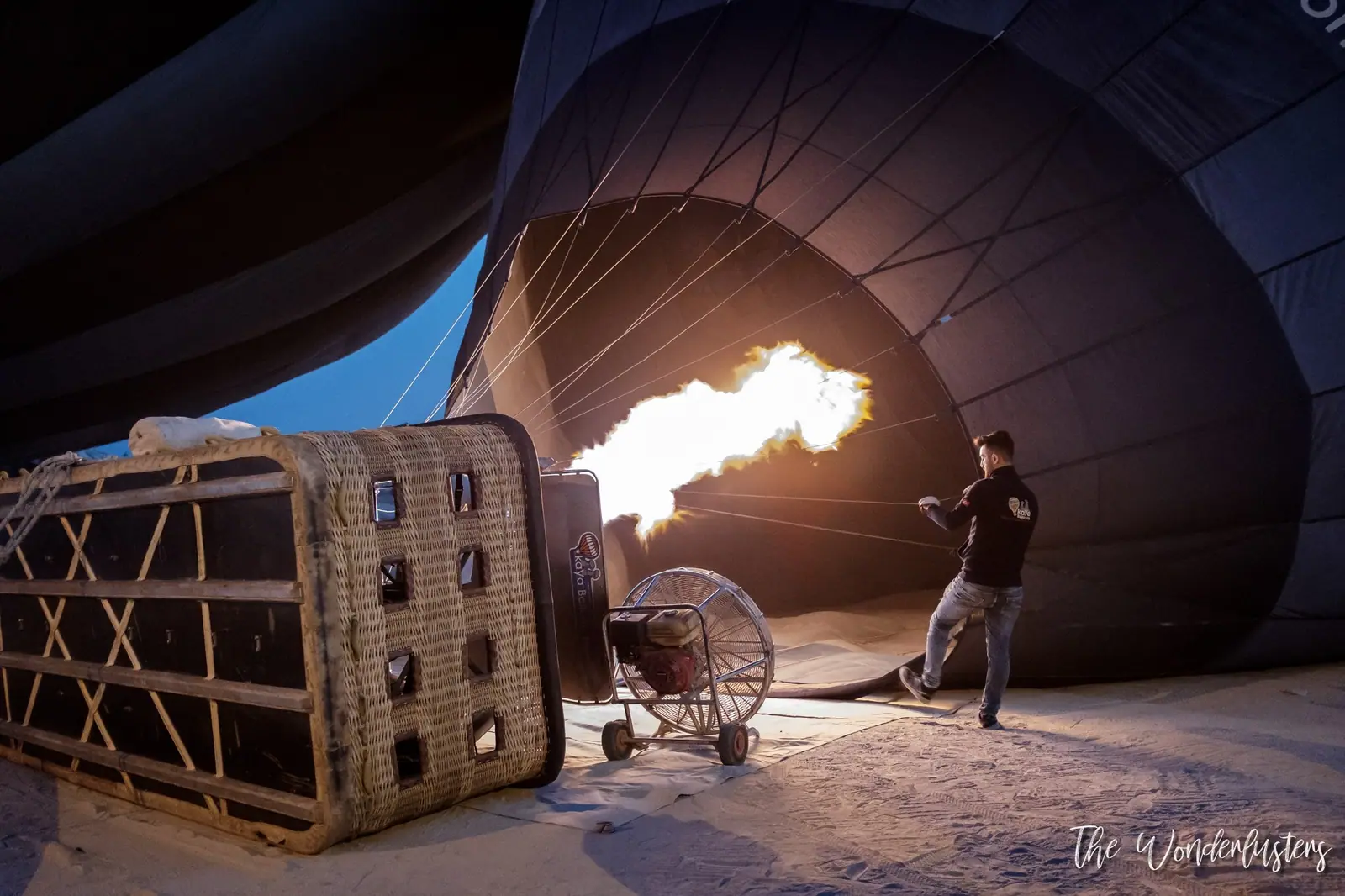 Hot air balloons taking off at sunrise