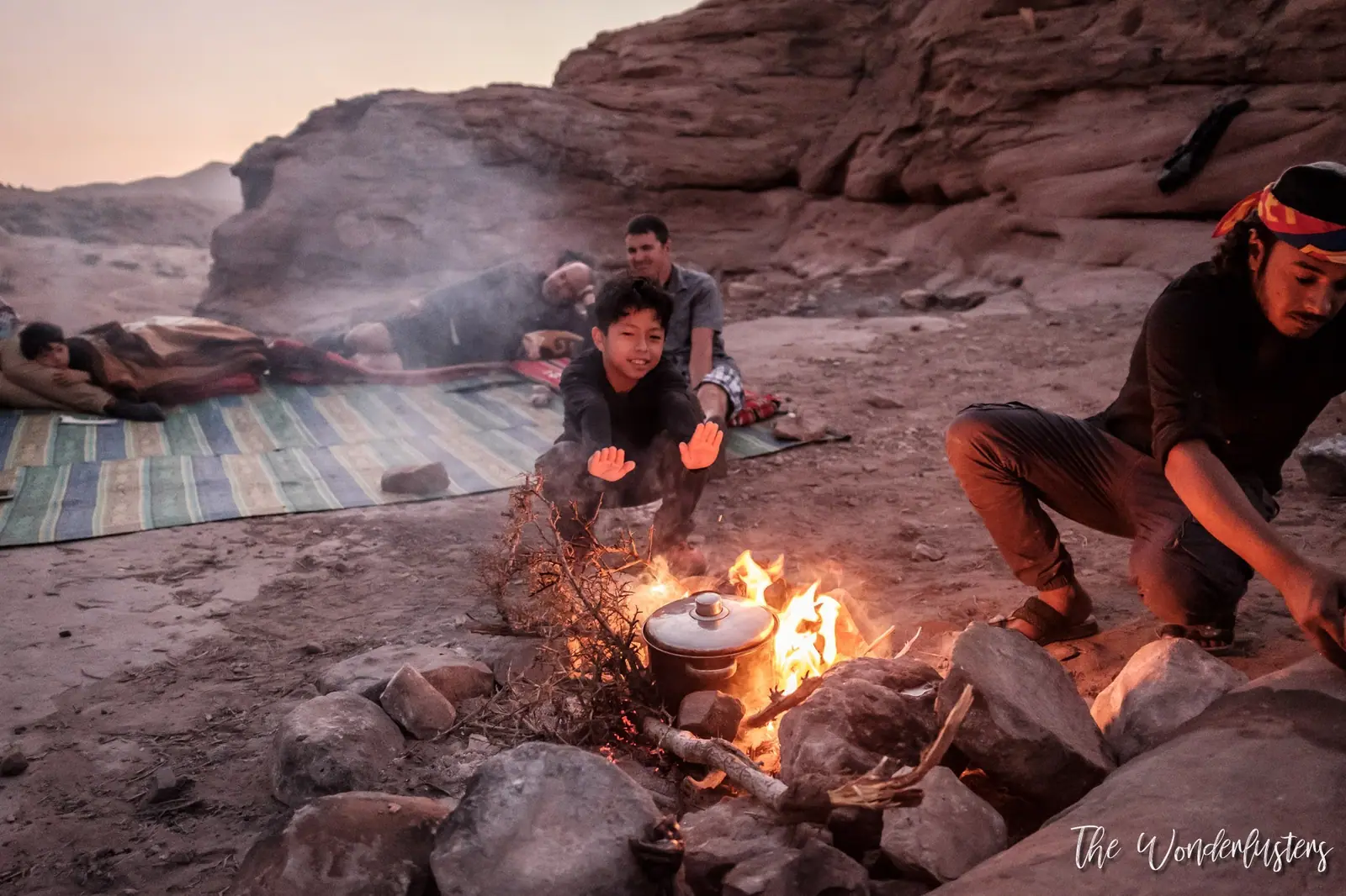 Bedouin hosts cooking a traditional meal