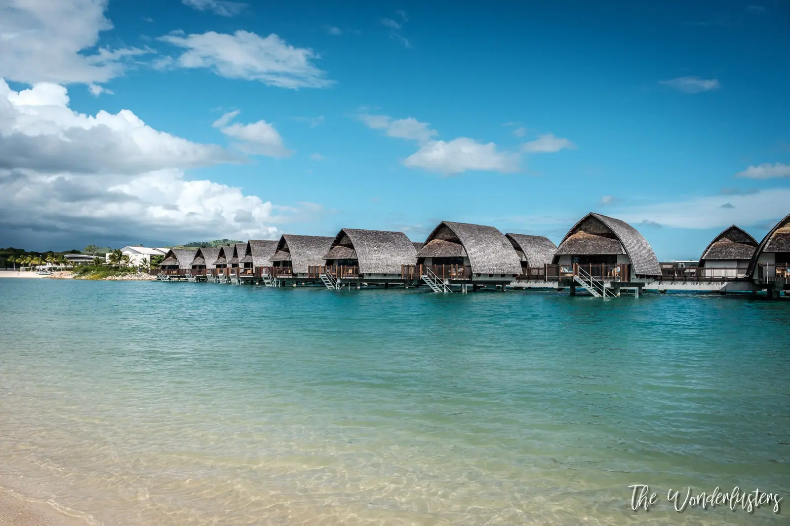 Overwater bures in the turquoise lagoon of Momi Bay