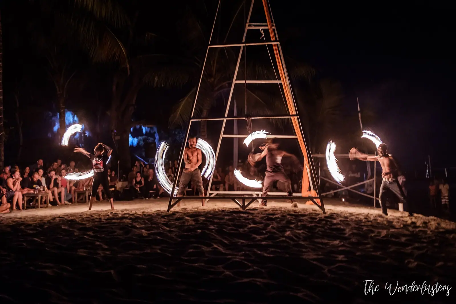 Fire dancers performing at night on Mele Beach, Efate