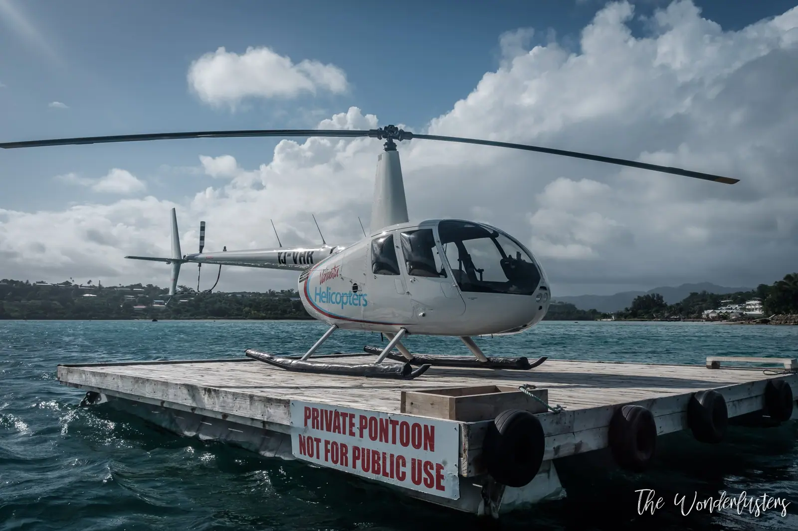 Vanuatu Helicopters helicopter on its floating pontoon in Port Vila