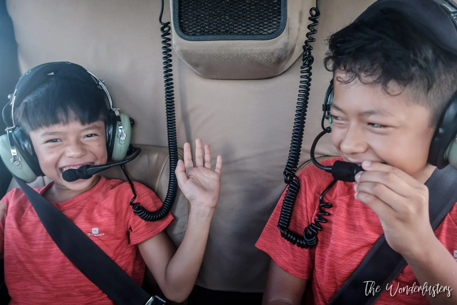 Our two boys wearing headsets during the helicopter ride