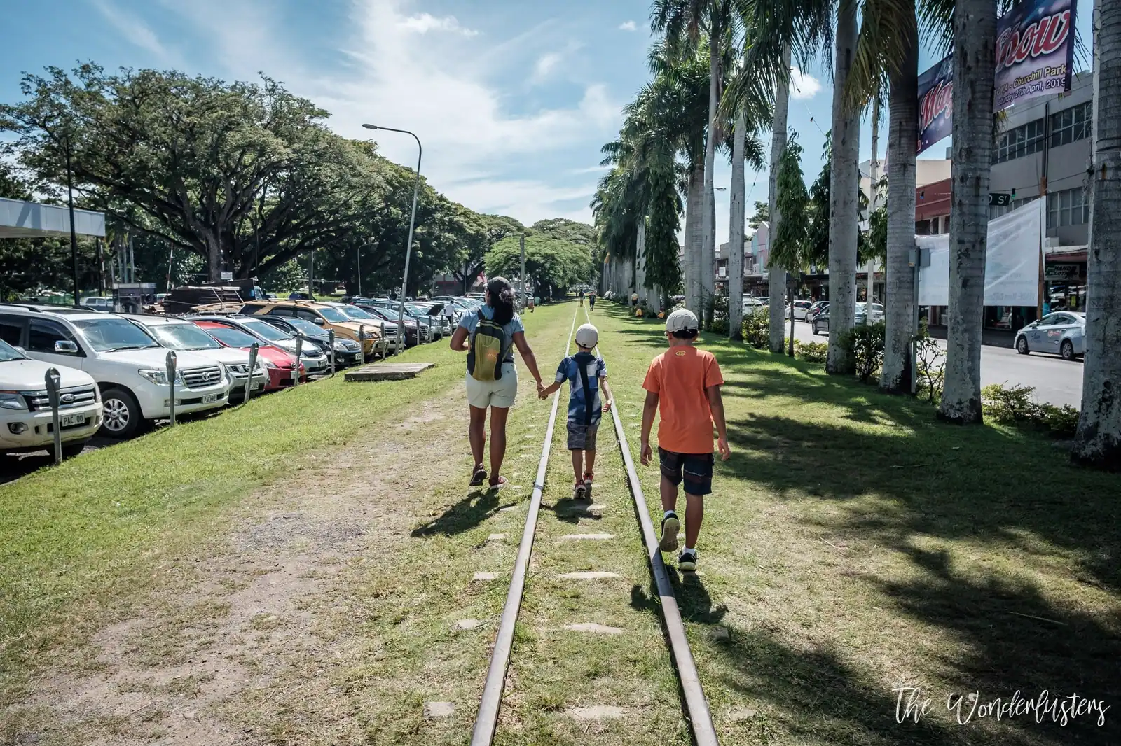 Our family walking along old railway tracks in Lautoka