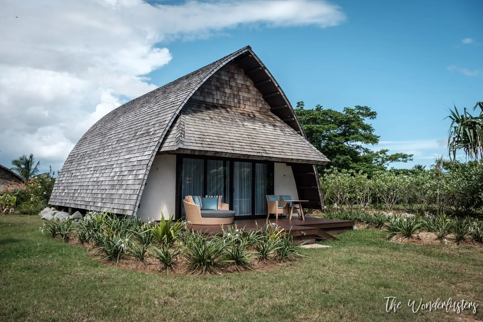 Our garden bure with its curved shingle roof at Momi Bay