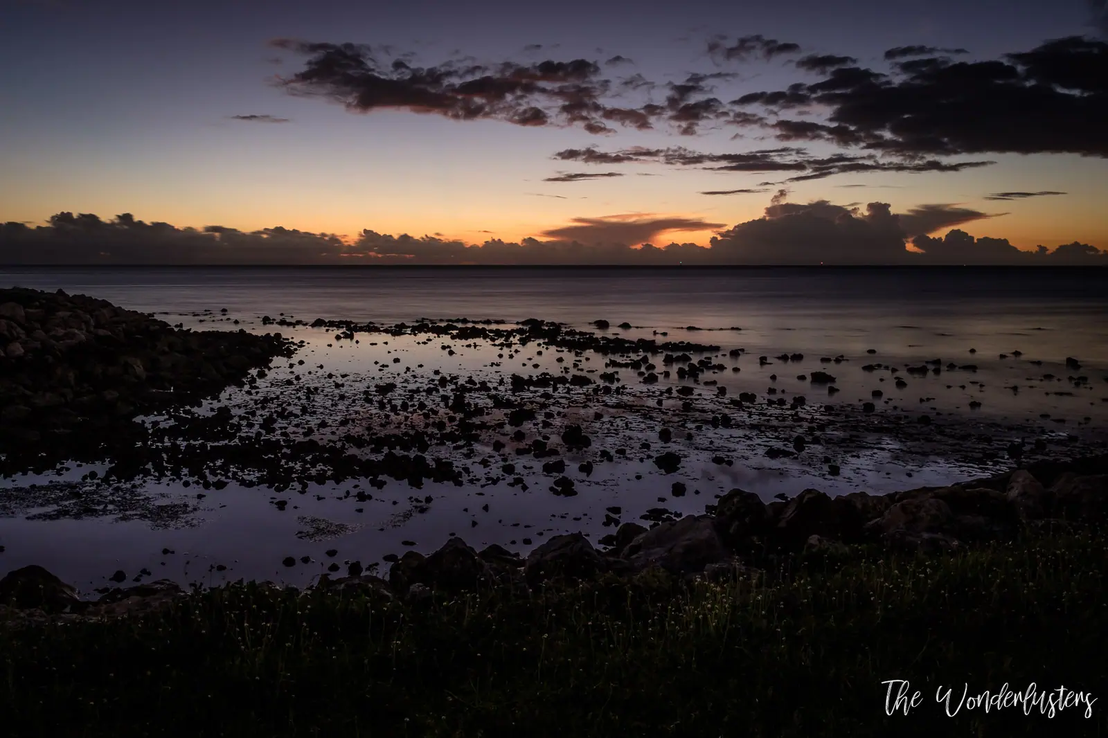 Sunset over the sea from our terrace at Momi Bay