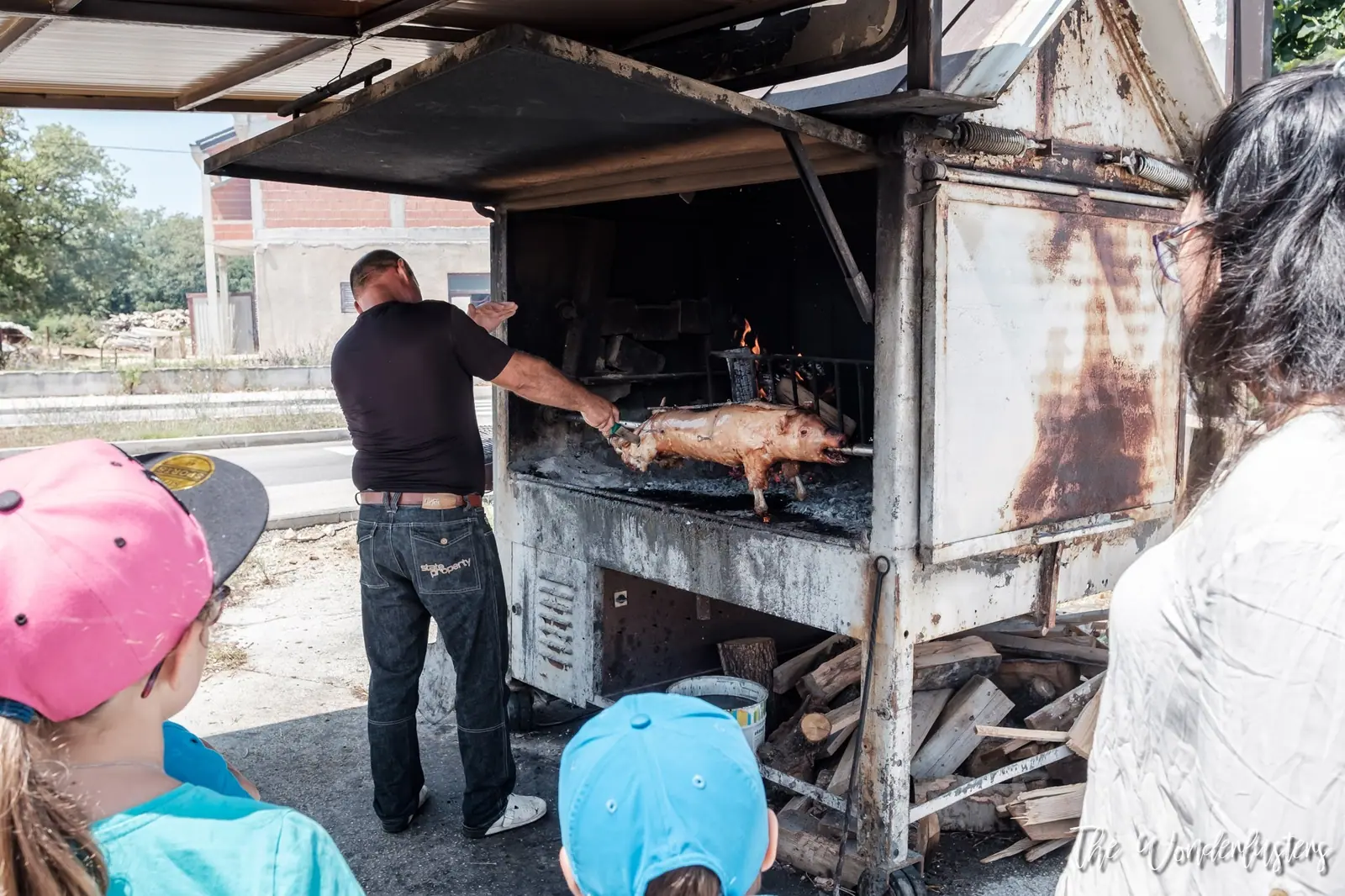 Suckling pig roasting on a spit