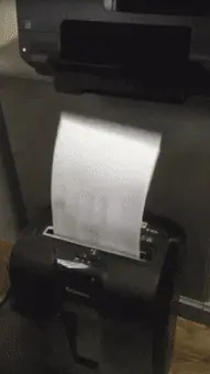 Printer feeding a sheet of paper straight into a shredder