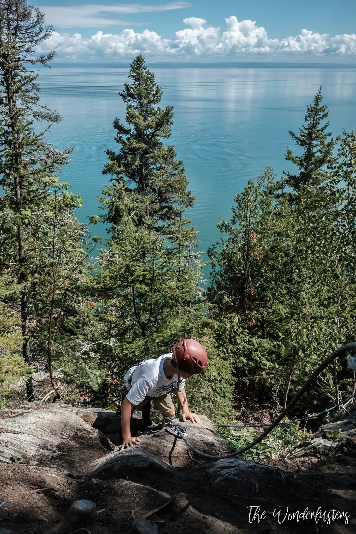 Climbing the via ferrata on the cliff at Le Manoir Richelieu